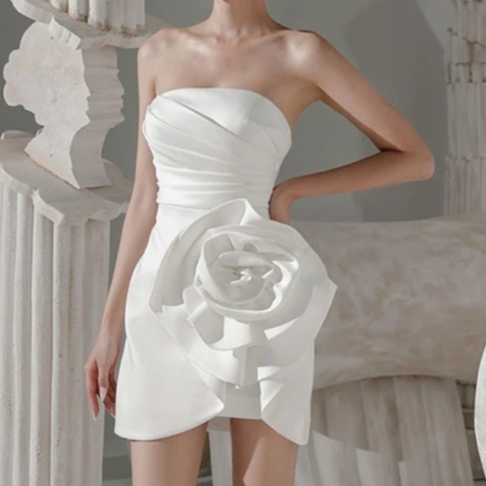Beautiful, white mini dress with satin appliqué. New with tags